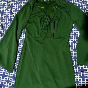 Green fashion to figure dress with front cut out tie